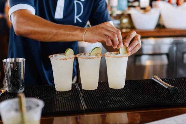 Bartender garnishing cocktails